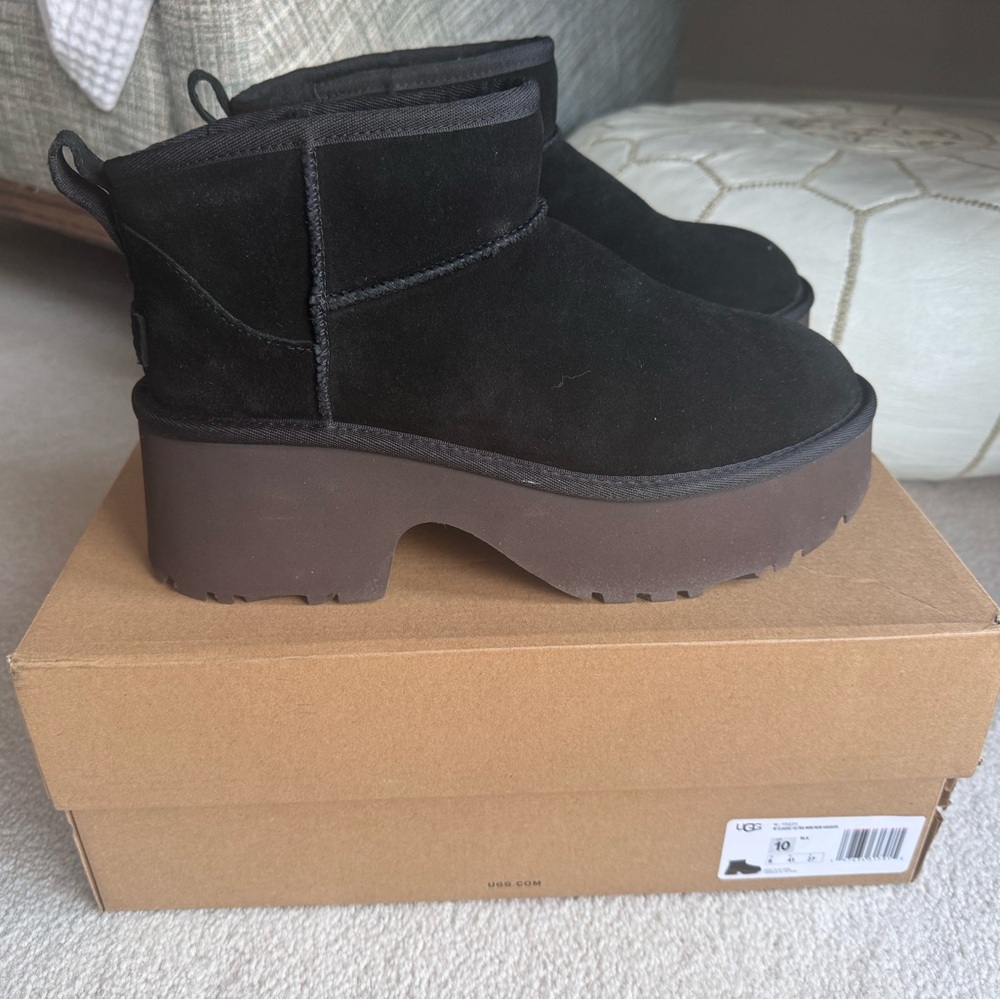 UGG Women's Classic Ultra Mini New Heights boots in black, size 10 US.